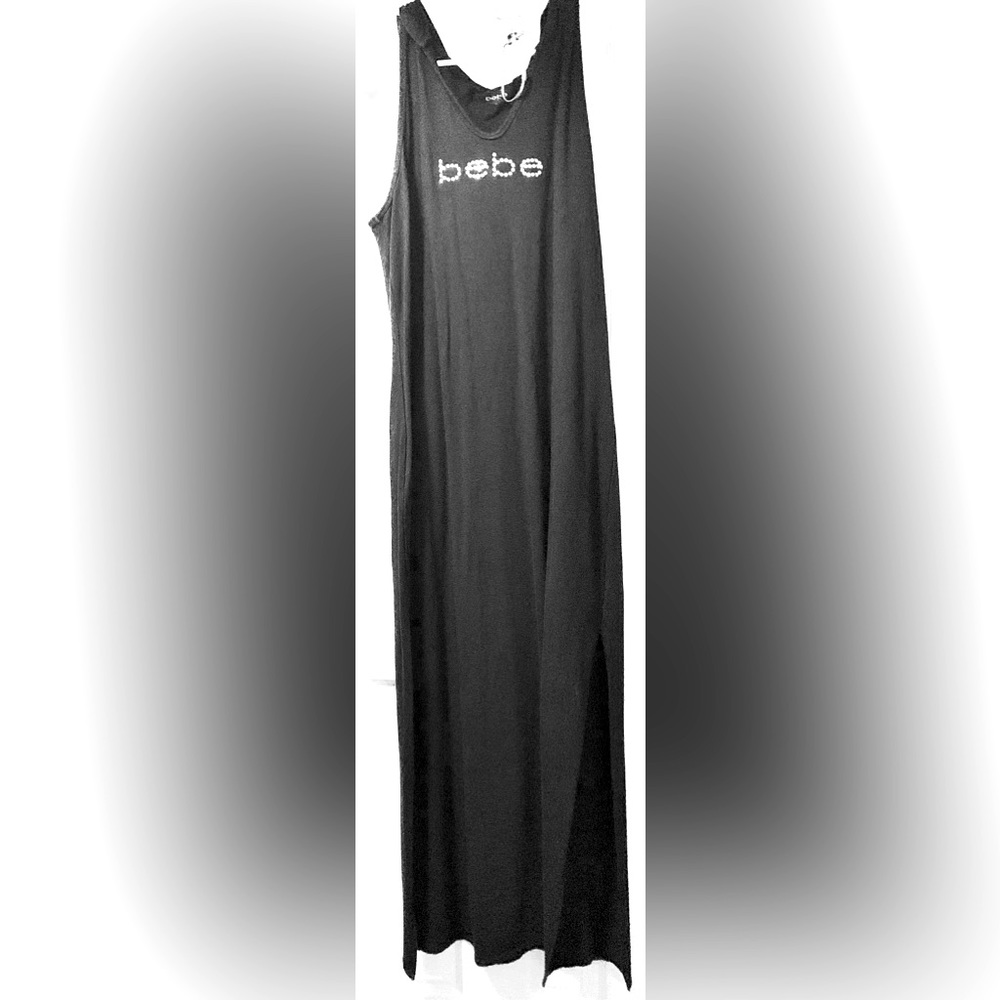 Ankle length BeBe dress with hood and side splits.
